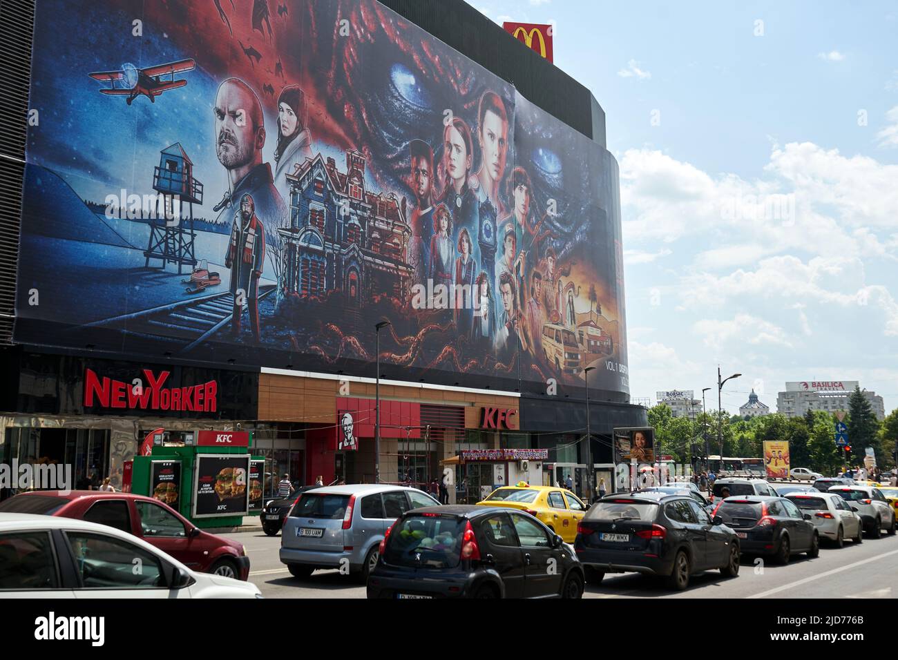 Bucharest, Romania - June 17, 2022: Extra large banner advertising Stranger Things seson 4 is displayed on the Unirea Shopping Center, in downtown Buc Stock Photo