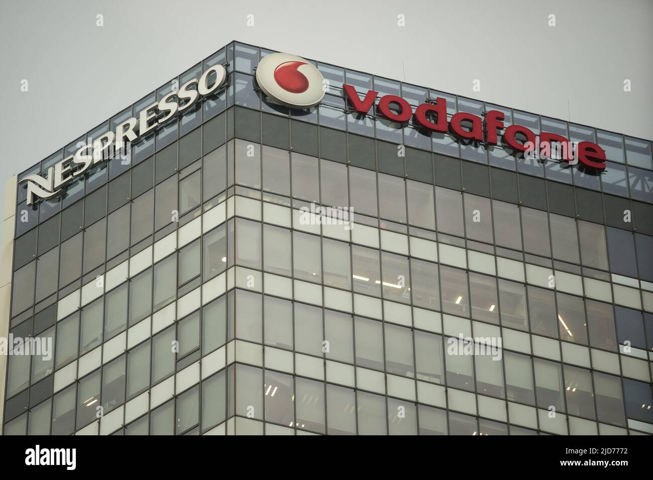 Bucharest, Romania - June 17, 2022: Logo of Nespresso, coffee Switzerland Nestle Group and Vodafone, British telecommunications company, are seen on a Stock Photo