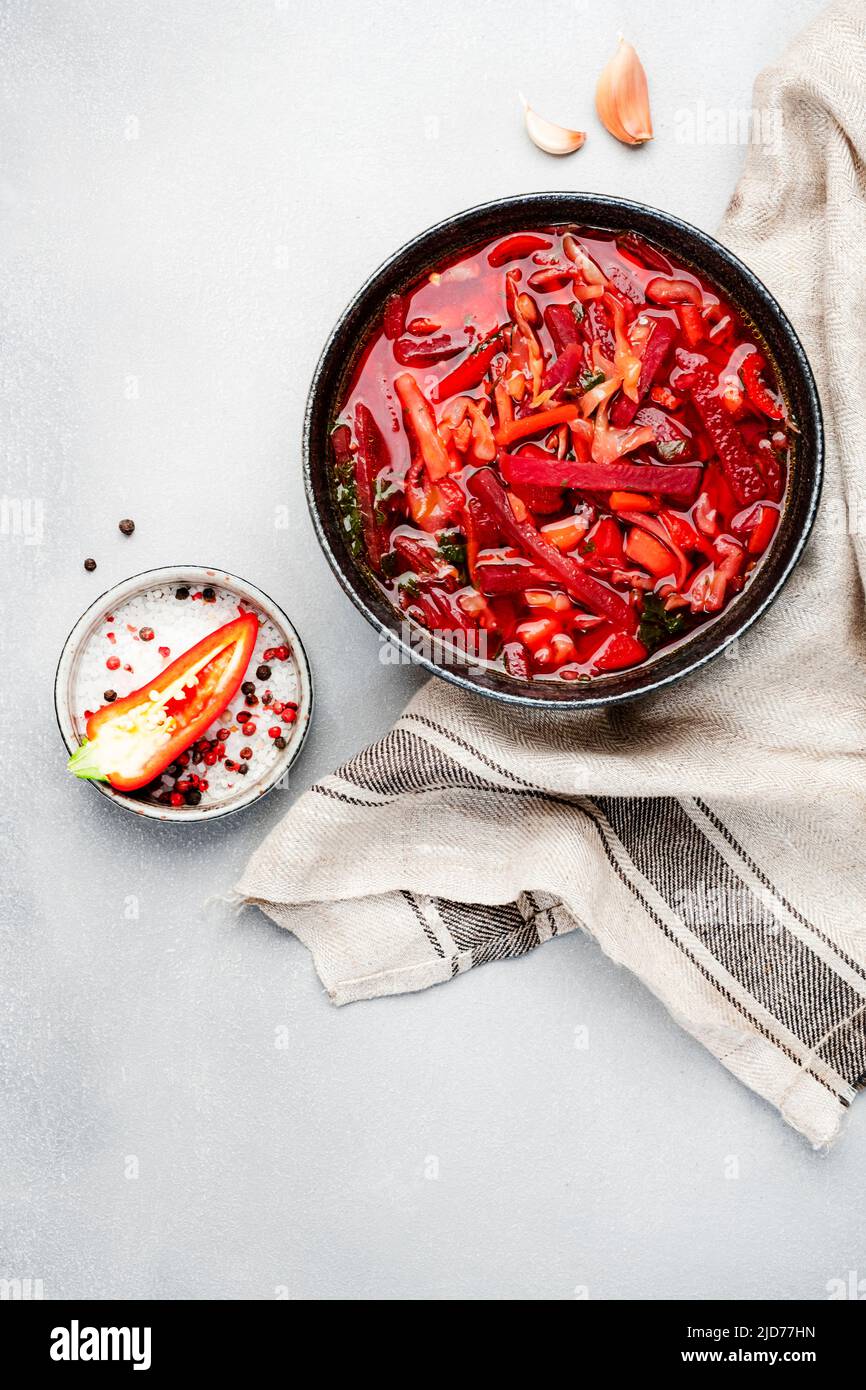 Summer Vegetable Soup with cabbage, beets, and herbs. Russian borscht