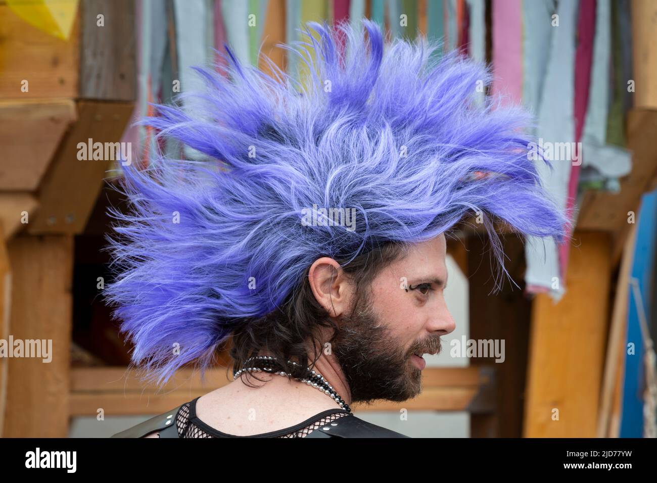 Seattle, Washington, USA. 18th June, 2022. A young man wears a colorful mohawk at the Fremont Solstice Parade. The iconic, annual parade returned after a three-year hiatus due to the coronavirus pandemic. Credit: Paul Christian Gordon/Alamy Live News Stock Photo