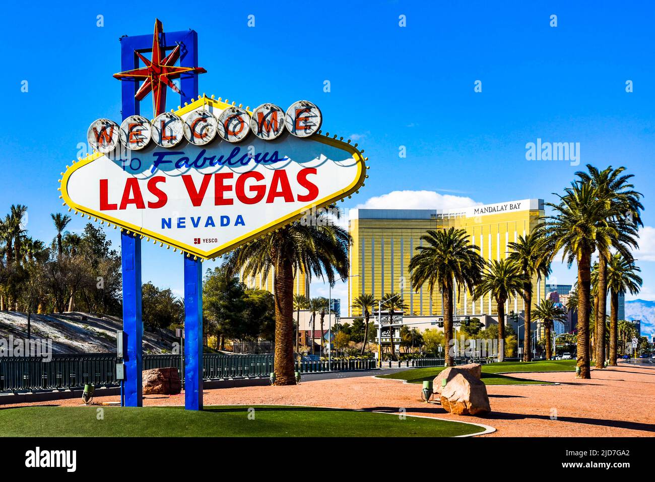 The iconic Welcome to Las Vegas Sign with Mandalay Bay Resort in the background. Stock Photo