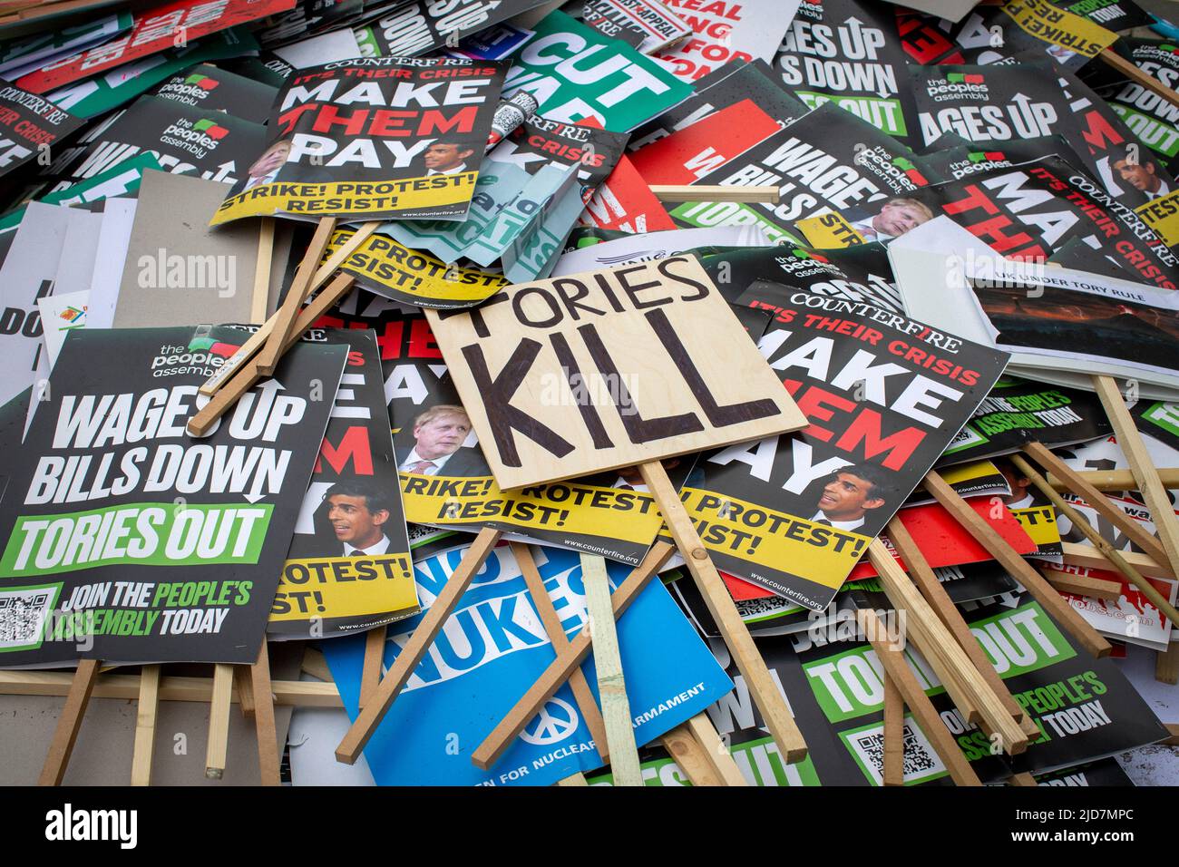 Anti-Tory Government protest signs on the floor during the TUC national demonstration in central London to demand action on the cost of living. Stock Photo