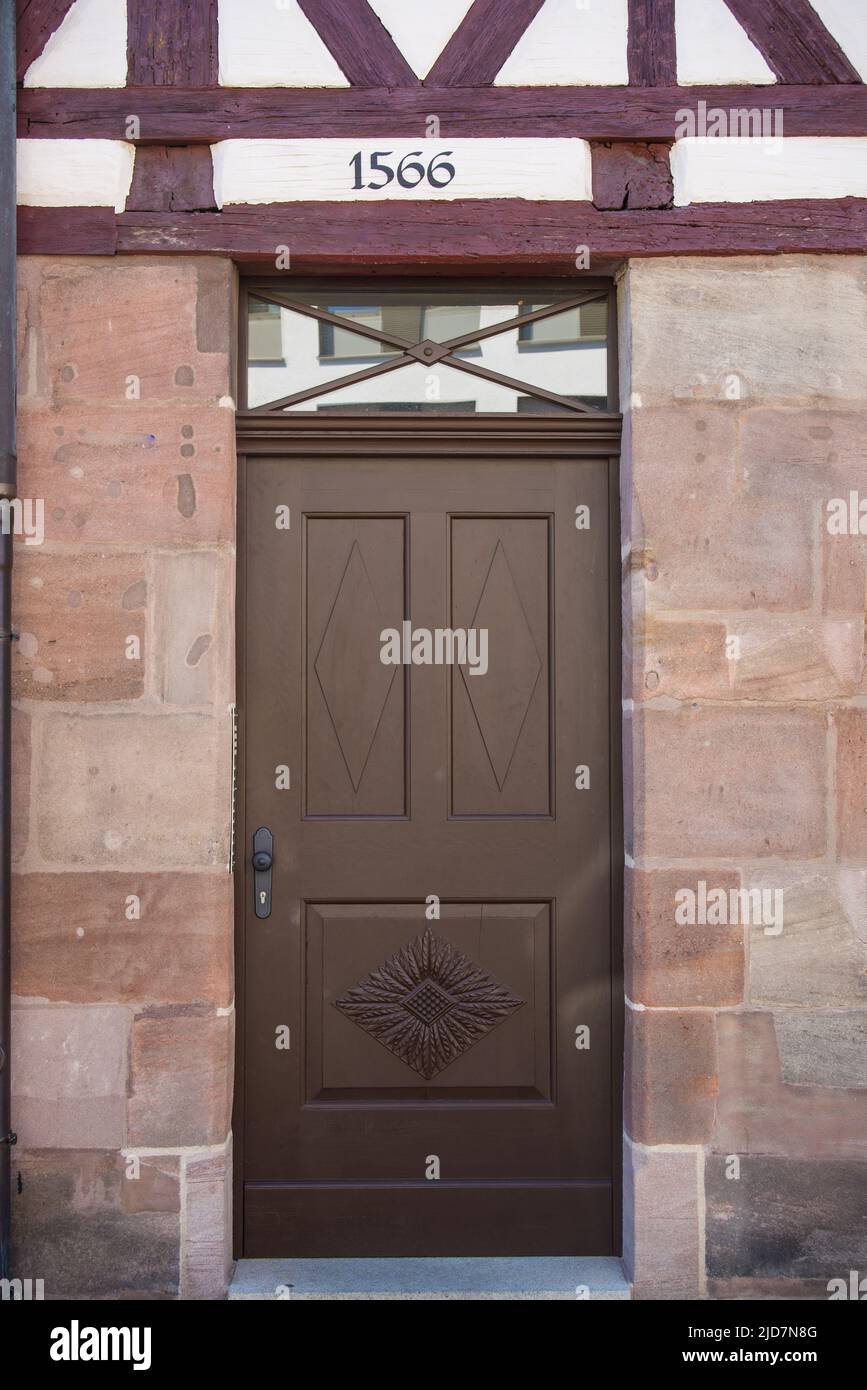 View of door in halftimbered house with construction on top Stock Photo