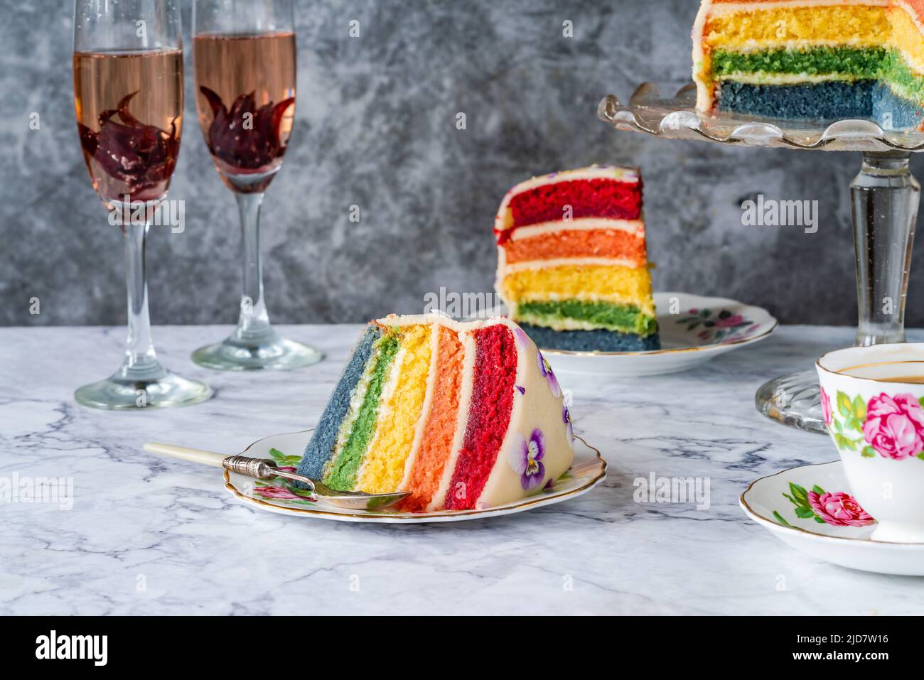 Multi layered rainbow cake sweet afternoon dessert Stock Photo Alamy