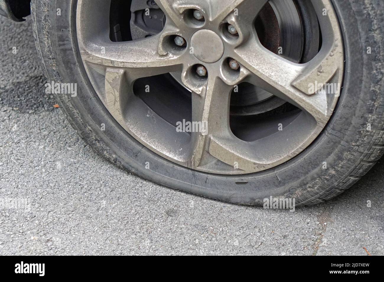 Flat tire deflated pneumatic car tyre wheel problem Stock Photo Alamy