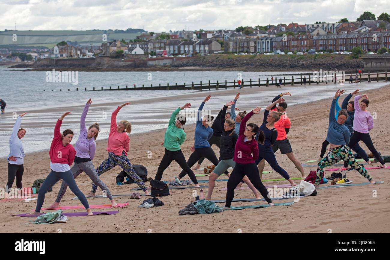 Yoga class on the beach hires stock photography and images Alamy