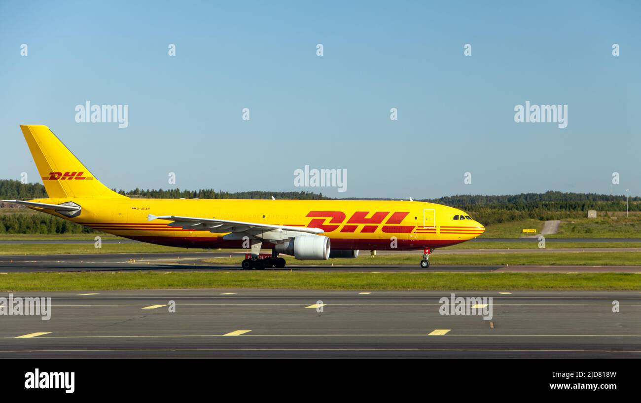 HELSINKI, FINLAND, JUNE 16 2022,The airplane Airbus A300B4-622R of delivery company DHL ride on the runway at the international airport Helsinki. Stock Photo