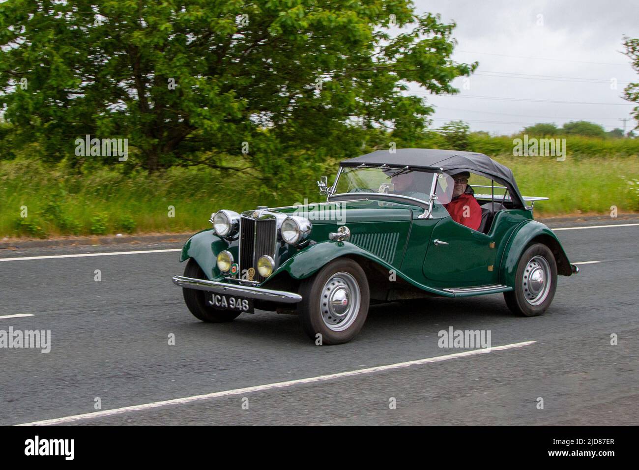 1953 50s fifties green MG TD 1200cc petrol roadster, 2dr, two-door, 2 door, two-seater soft-top; classic, vintage sports vehicle en-route to Lytham St Annes, Lancashire, UK Stock Photo