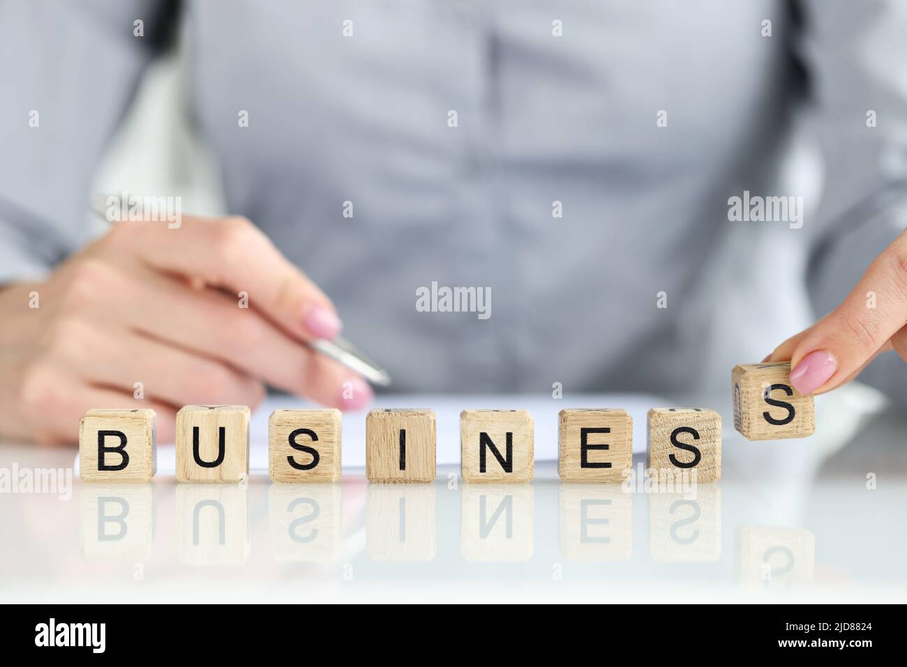 Woman putting paper word hi-res stock photography and images - Alamy