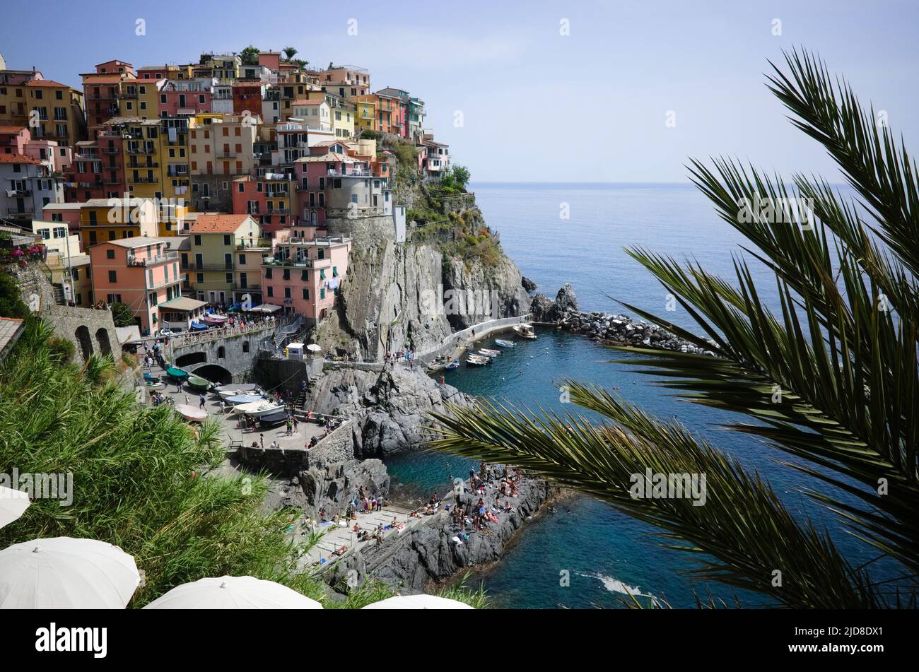 Manarola, Liguria, Italy - May, 2022: View of touristic village with typical Italian buildings in Cinque Terre National Park. Small town with colorful Stock Photo