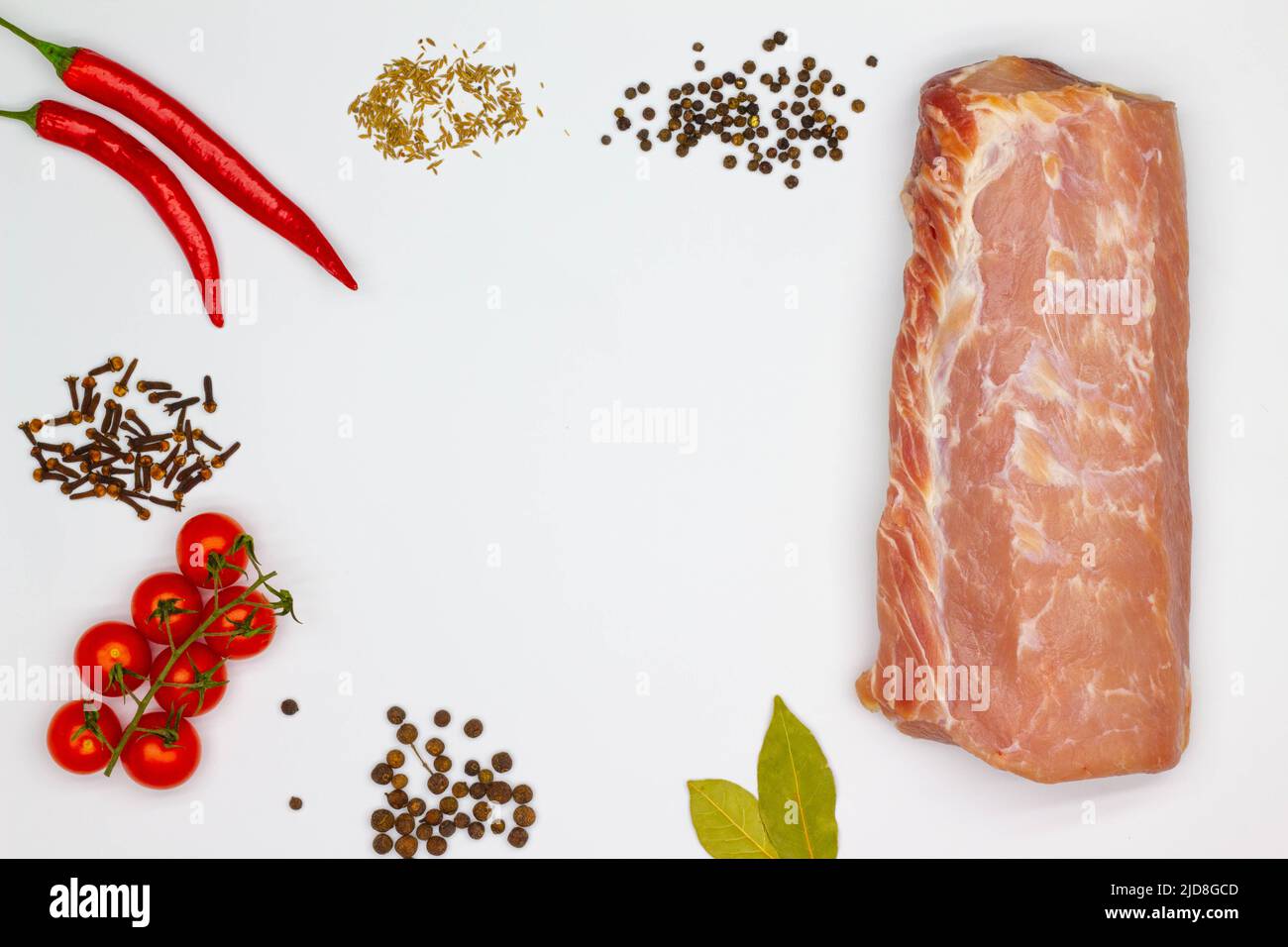 Meat and spices. Isolated. Large piece of meat, red hot chili pepper