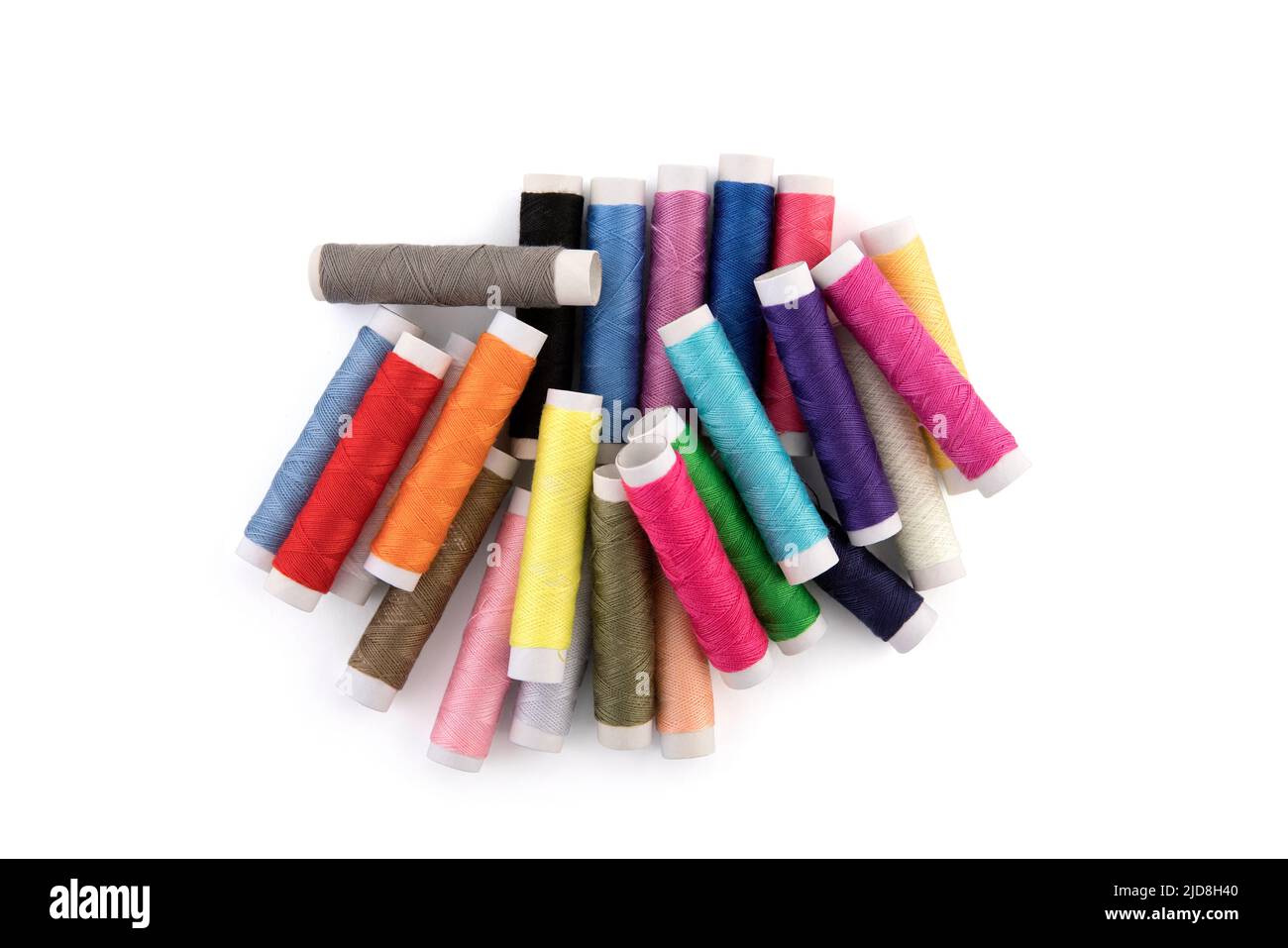 Colourful thread spools on white background with clipping path Stock Photo