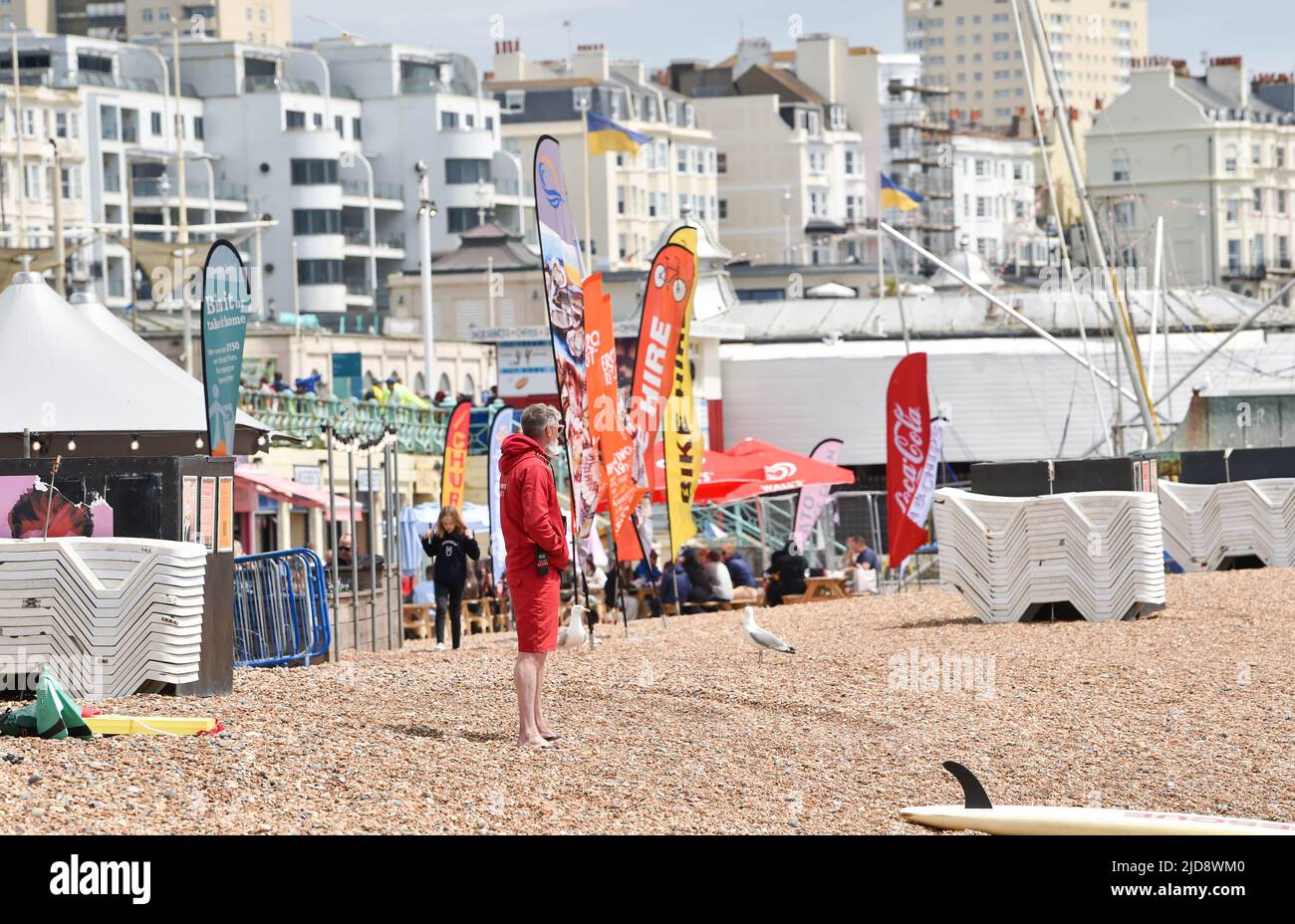 Brighton UK 19th June 2022 - Brighton beach is much quieter at lunchtime today as cooler weather spreads across Britain after the recent hot spell .   : Credit Simon Dack / Alamy Live News Stock Photo