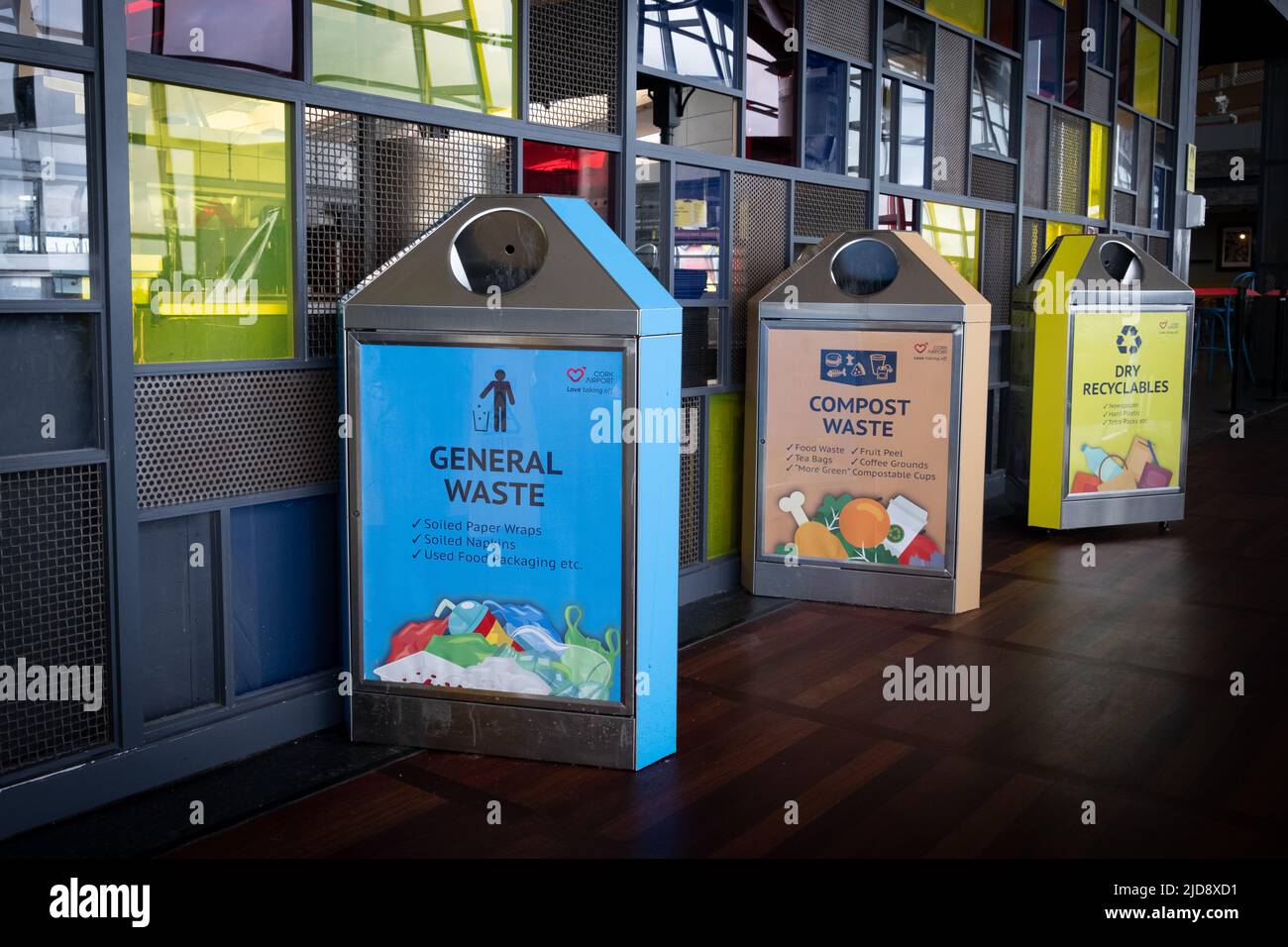 Row of recycling bins for different waste at cork international airport Stock Photo