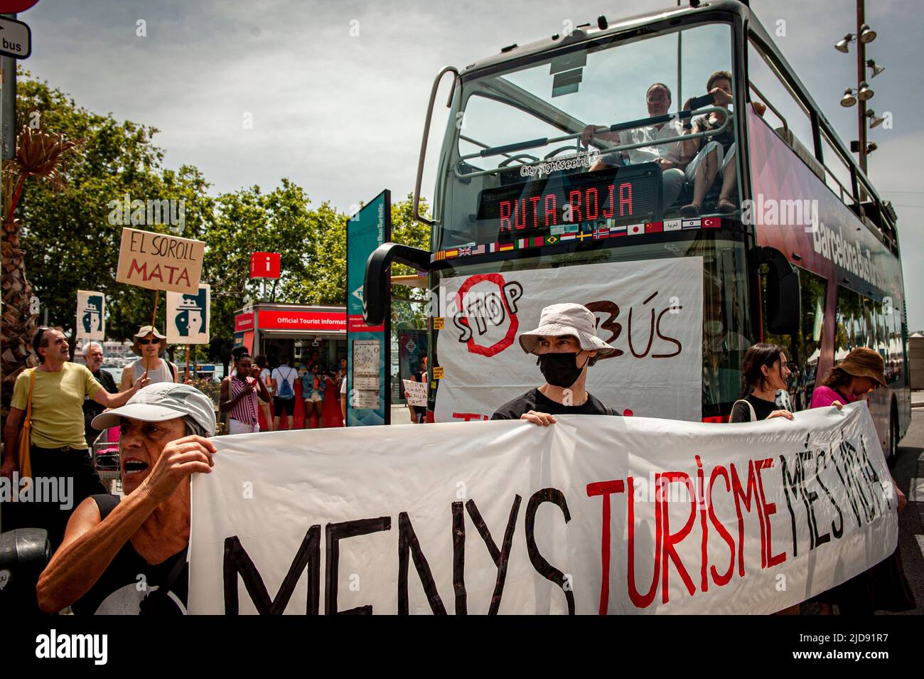Barcelona residents block a tourist bus on route during a protest against mass tourism in the city. Stock Photo