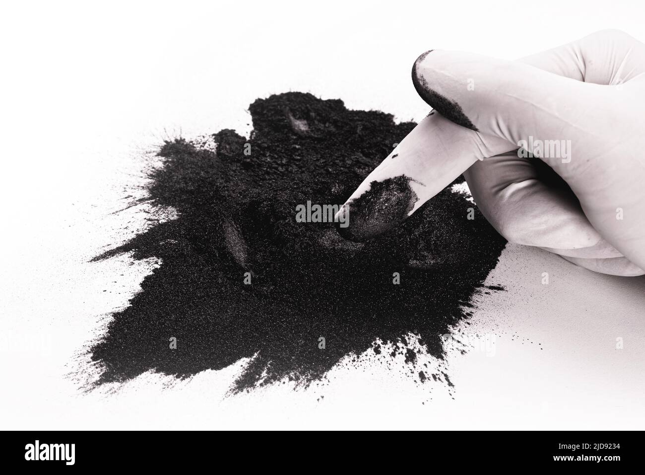 hand holding Graphite powder, it serves to dry lubricate locks