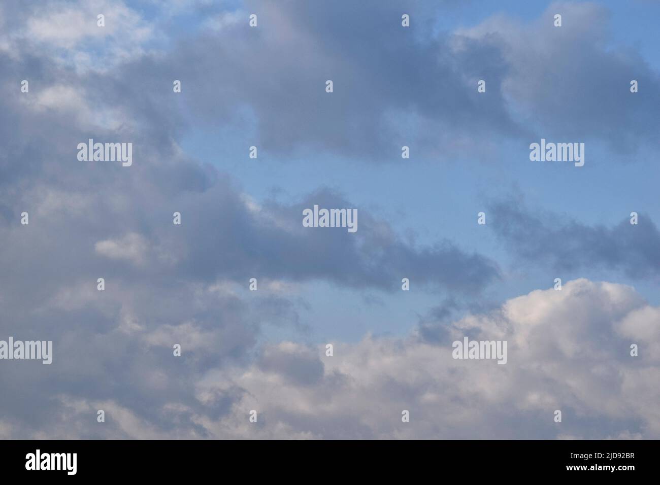 pale blue sky with grey and white clouds, suffolk Stock Photo