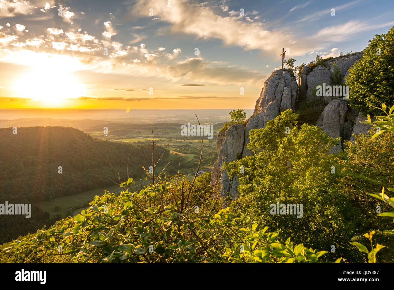 Dramatic sunset over a scenic cliff ledge in the Swabian Jura in Southern Germany Stock Photo