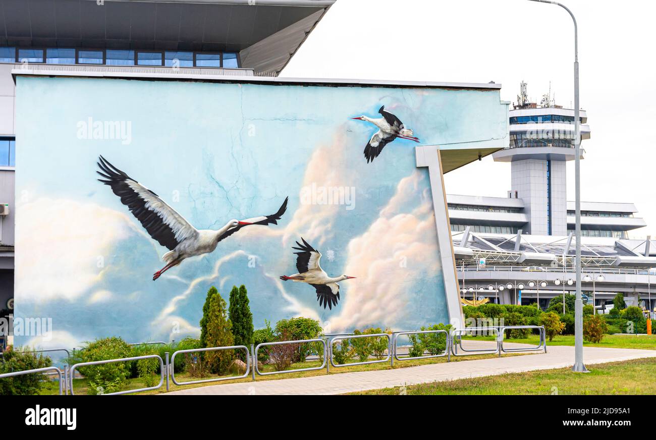 Mural depicting cranes- symbolic bird of Belarus on the Minsk national airport wall Stock Photo