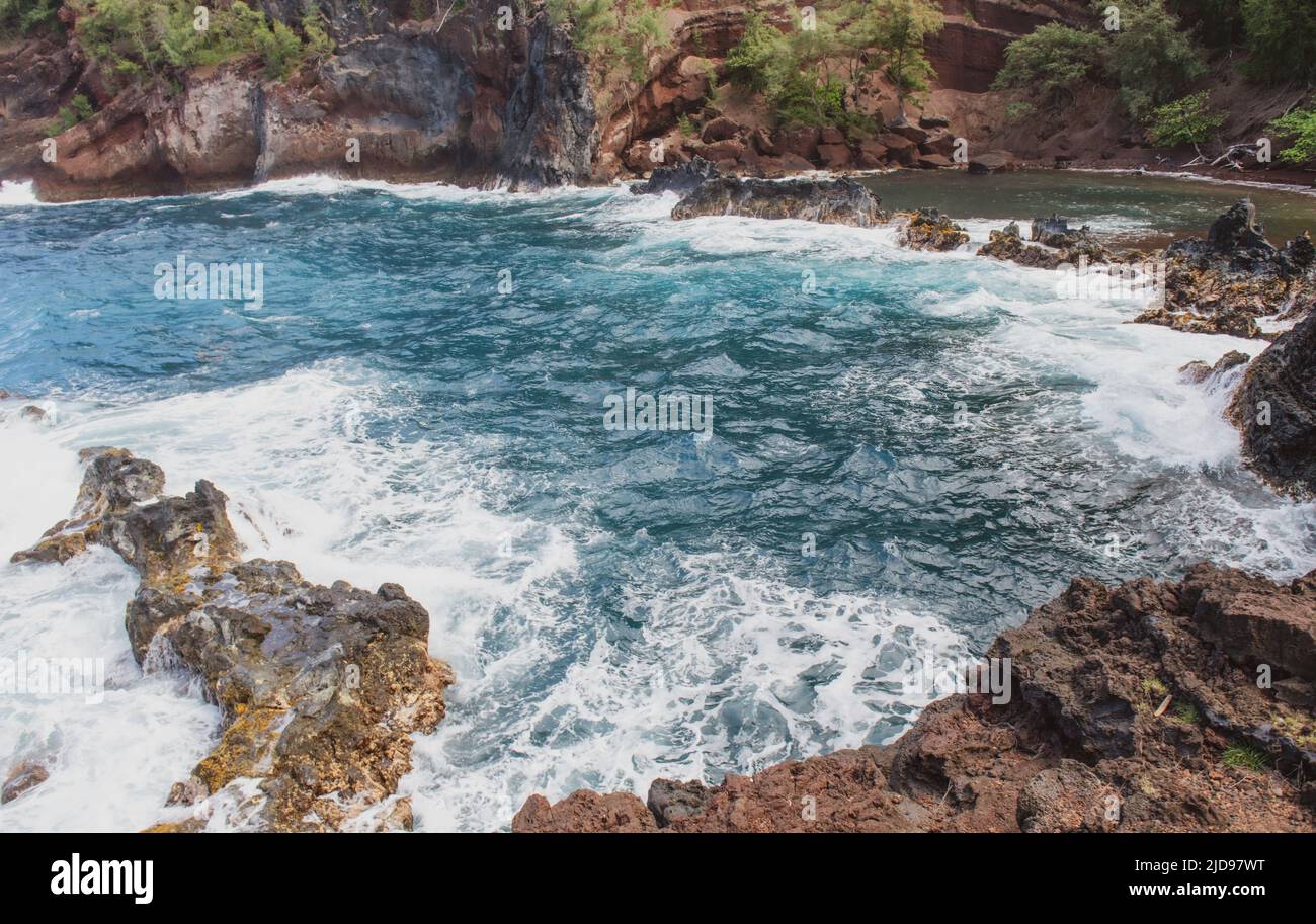 View of sea beach with waves and rocky coast Stock Photo - Alamy