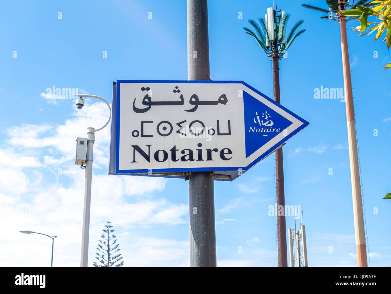 Notaire notary street direction sign in French, berber, and Arabic