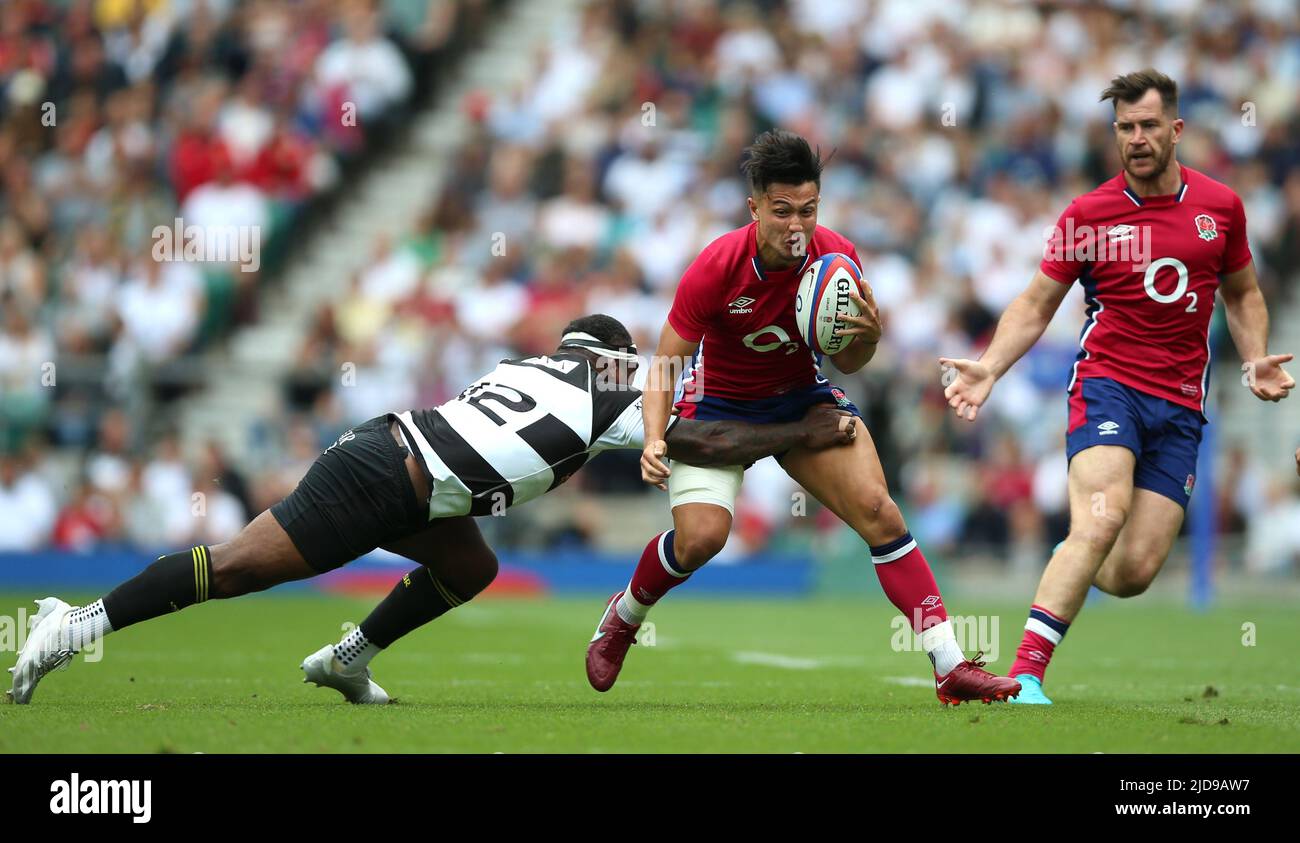EnglandÕs Marcus Smith is tackled by Barbarians' Levani Botia during the International Friendly match at Twickenham Stadium, London. Picture date: Sunday June 19, 2022. Stock Photo