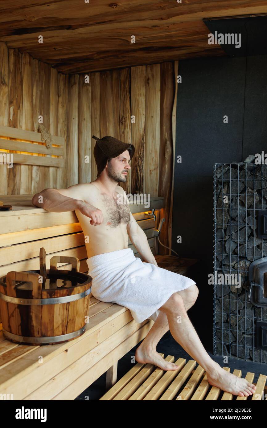 Handsome man relaxing in sauna Stock Photo