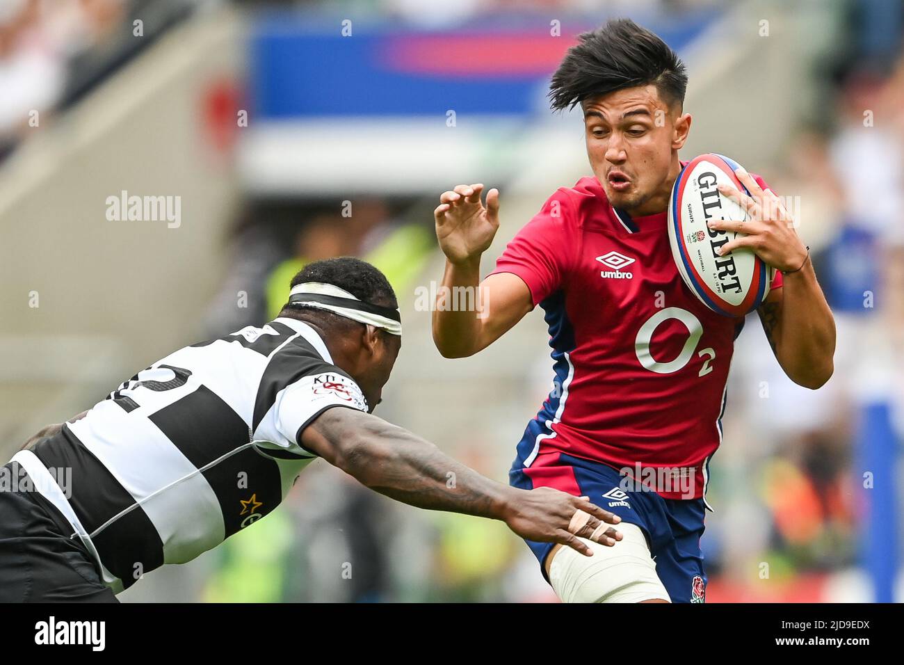 Marcus Smith of England is tackled by Levani Botia of Barbarians Stock Photo