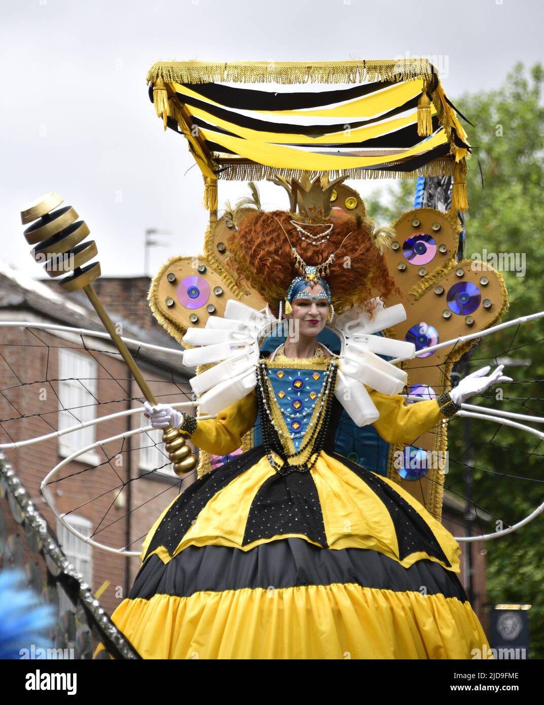 Manchester, UK, 19th June, 2022. The Queen Bee float. Performers and artists take part in the Manchester Day Parade, Manchester, England, United Kingdom. Organisers say: 'Over 1,500 performers and artists from local communities bring Manchester city centre to life in a fantastic display of colour, sound and movement. An audience of more than 60,000 are wowed by the incredible day of amazing structures, vibrant costumes and pulsating music and dance'. Credit: Terry Waller/Alamy Live News Stock Photo