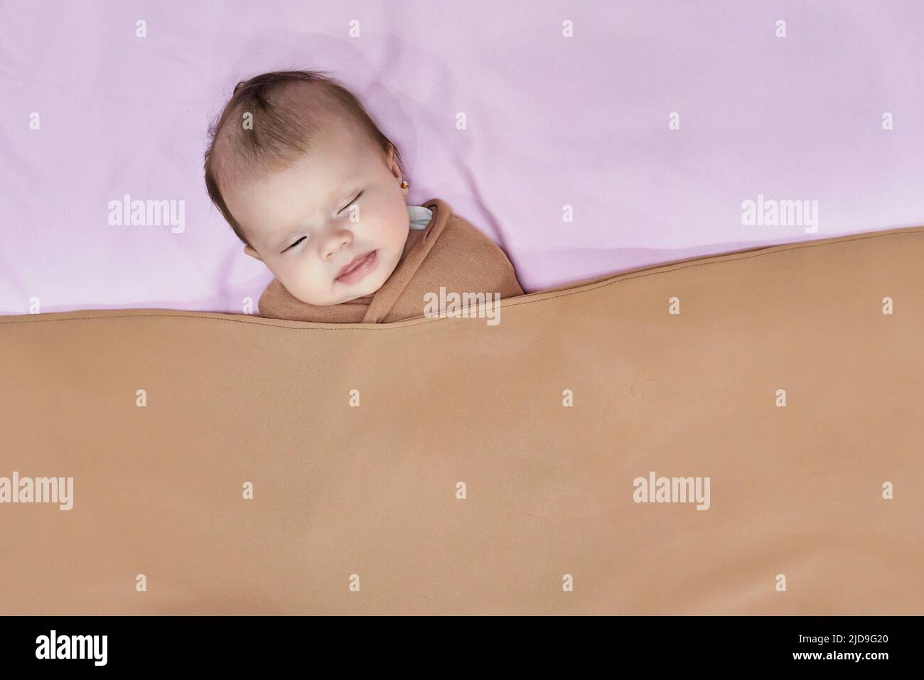 Newborn baby girl, sleeping on a blanket Stock Photo Alamy