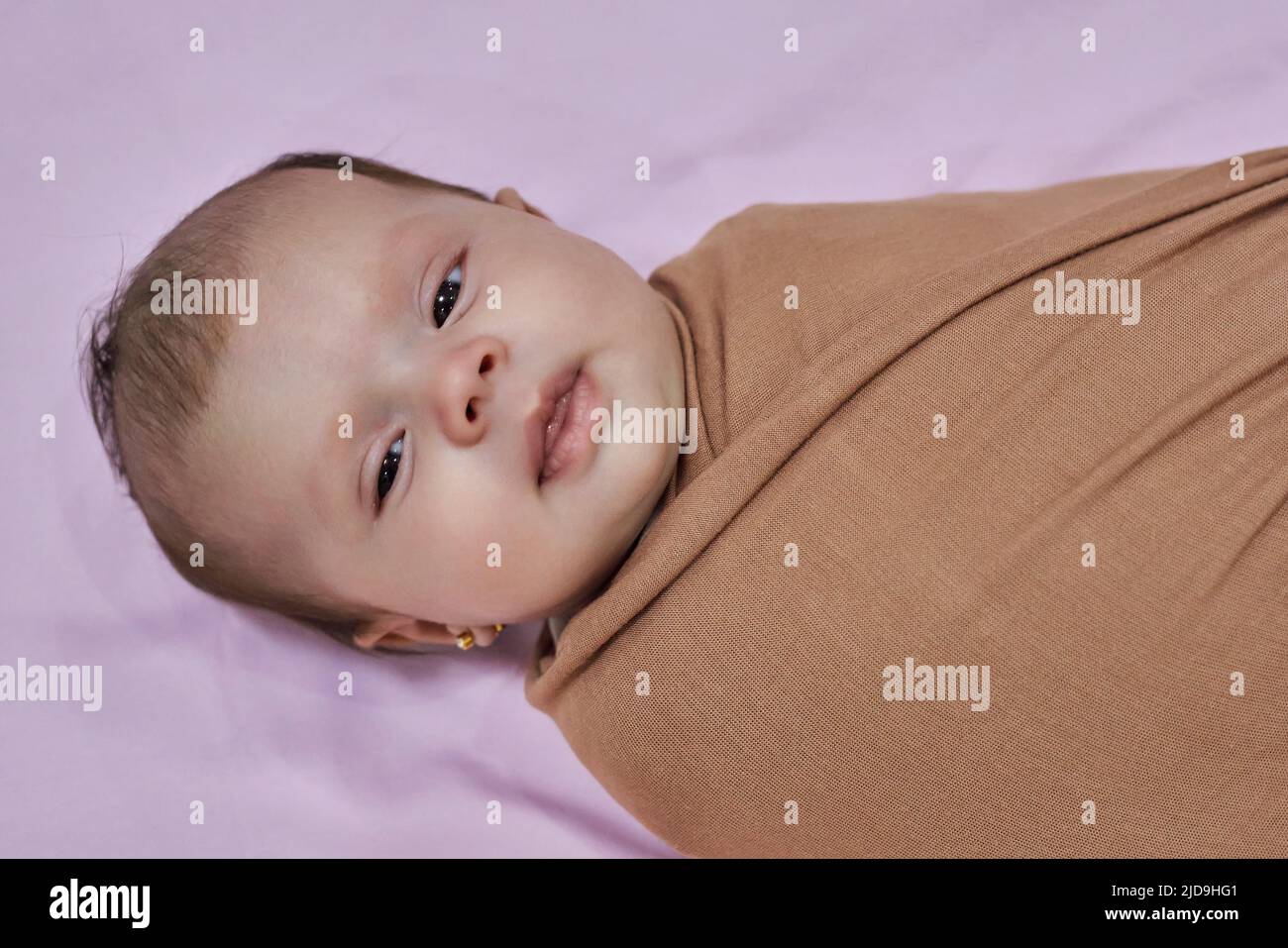 Newborn baby girl, sleeping on a blanket Stock Photo Alamy