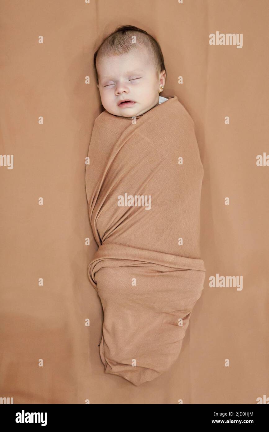 Newborn baby girl, sleeping on a blanket Stock Photo Alamy