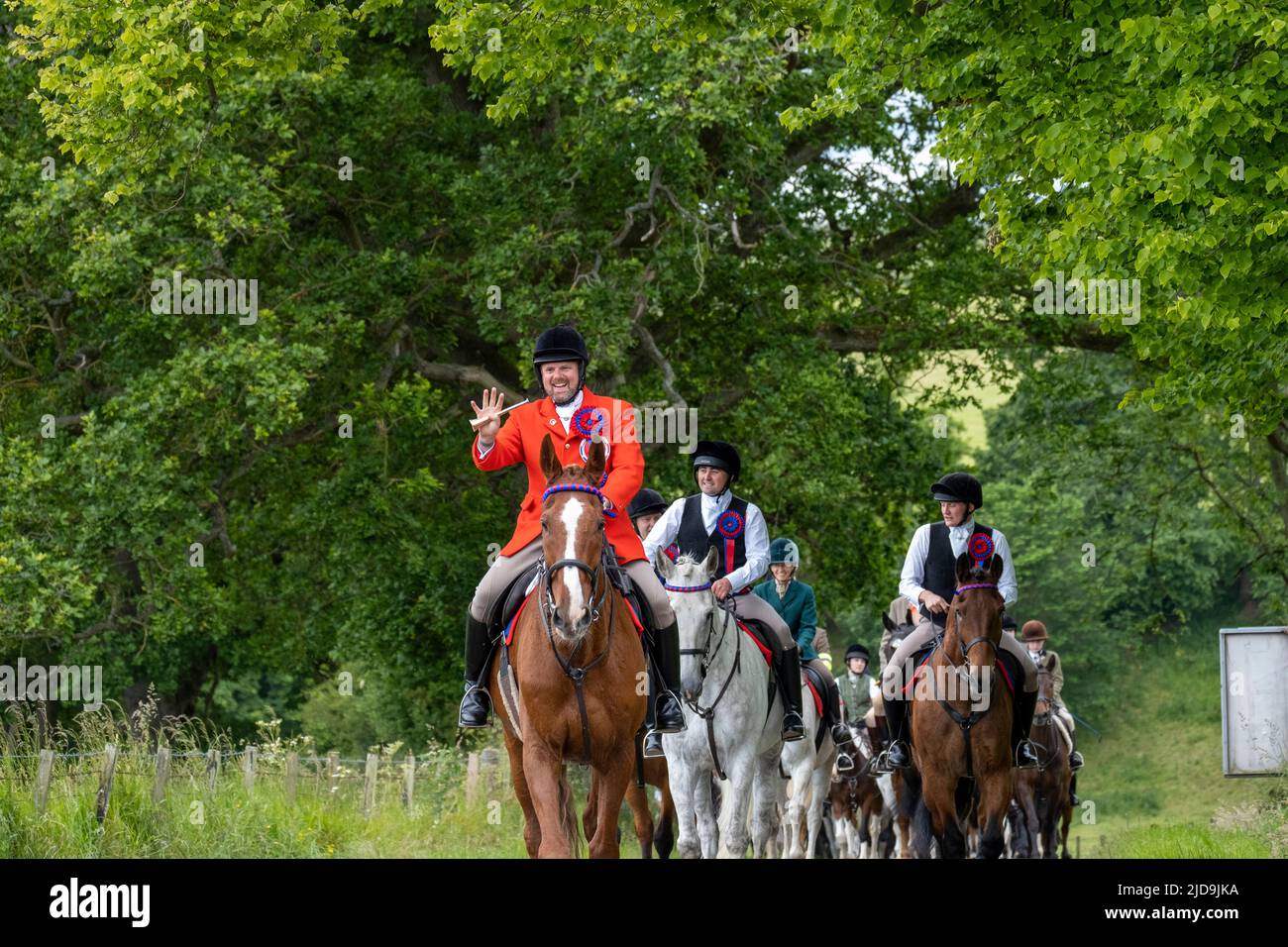 Jedburgh, UK. 19th June 2022.. Jethart Callant's Herald, Robert Reid (in red), leads the Principals, 2022 Jethart Callant Gregor Paxton, Right Hand Man Euan Munro, Left Hand Man, Nicholas Arnold ahead of a cavalcade of 40 mounted followers on the traditional hideout to Morebattle in the Scottish Borders, where they will meet Kelso Civic Week principals and followers. ( Credit: Rob Gray/Alamy Live News Stock Photo