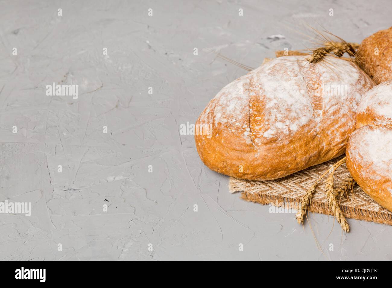 Homemade natural breads. Different kinds of fresh bread as background, perspective view with