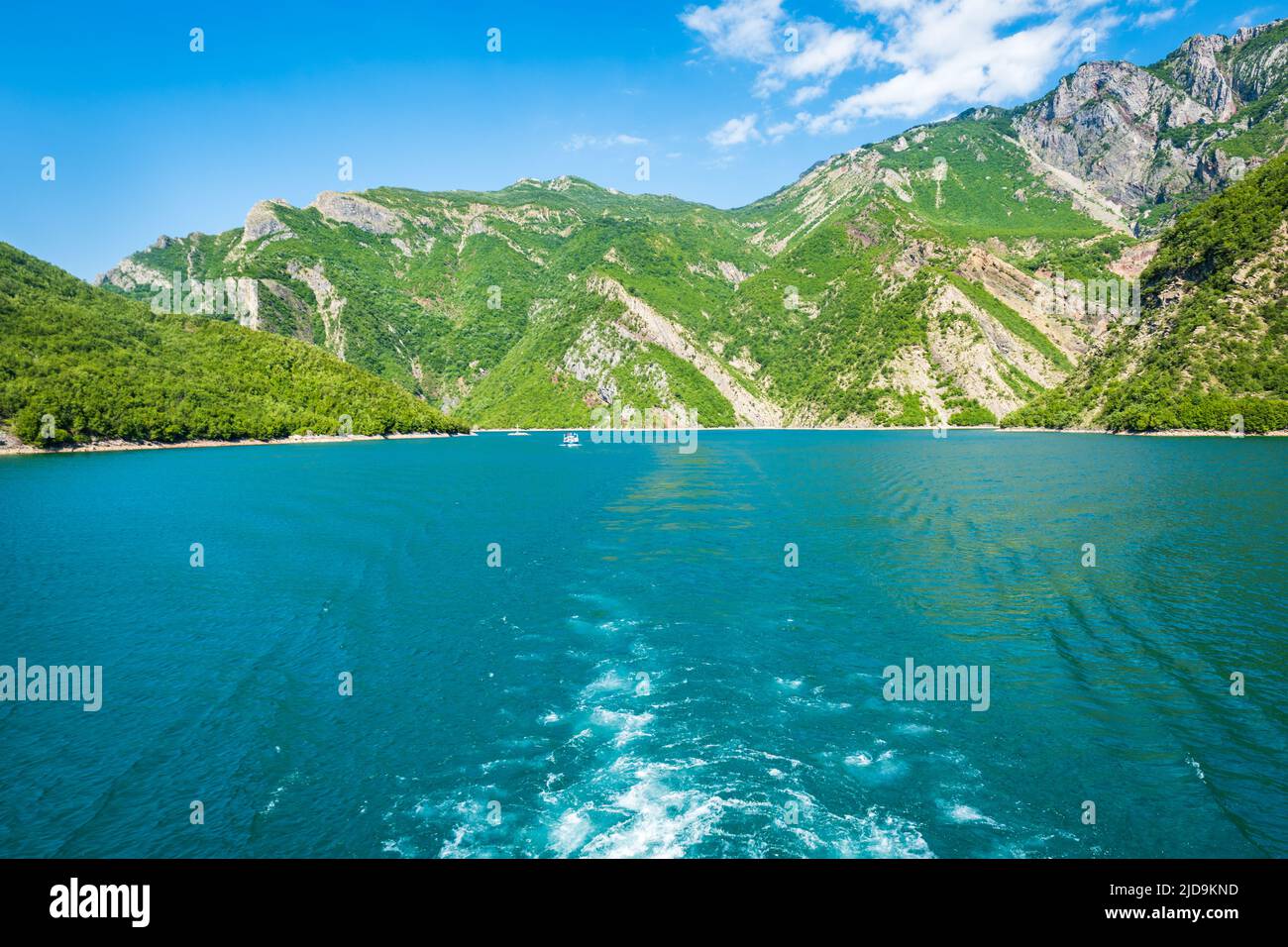 Komani Lake ferry cruise boat view near the town of Fierzë, Albania. Komani Lake is a popular tourist destination in Albania. Stock Photo