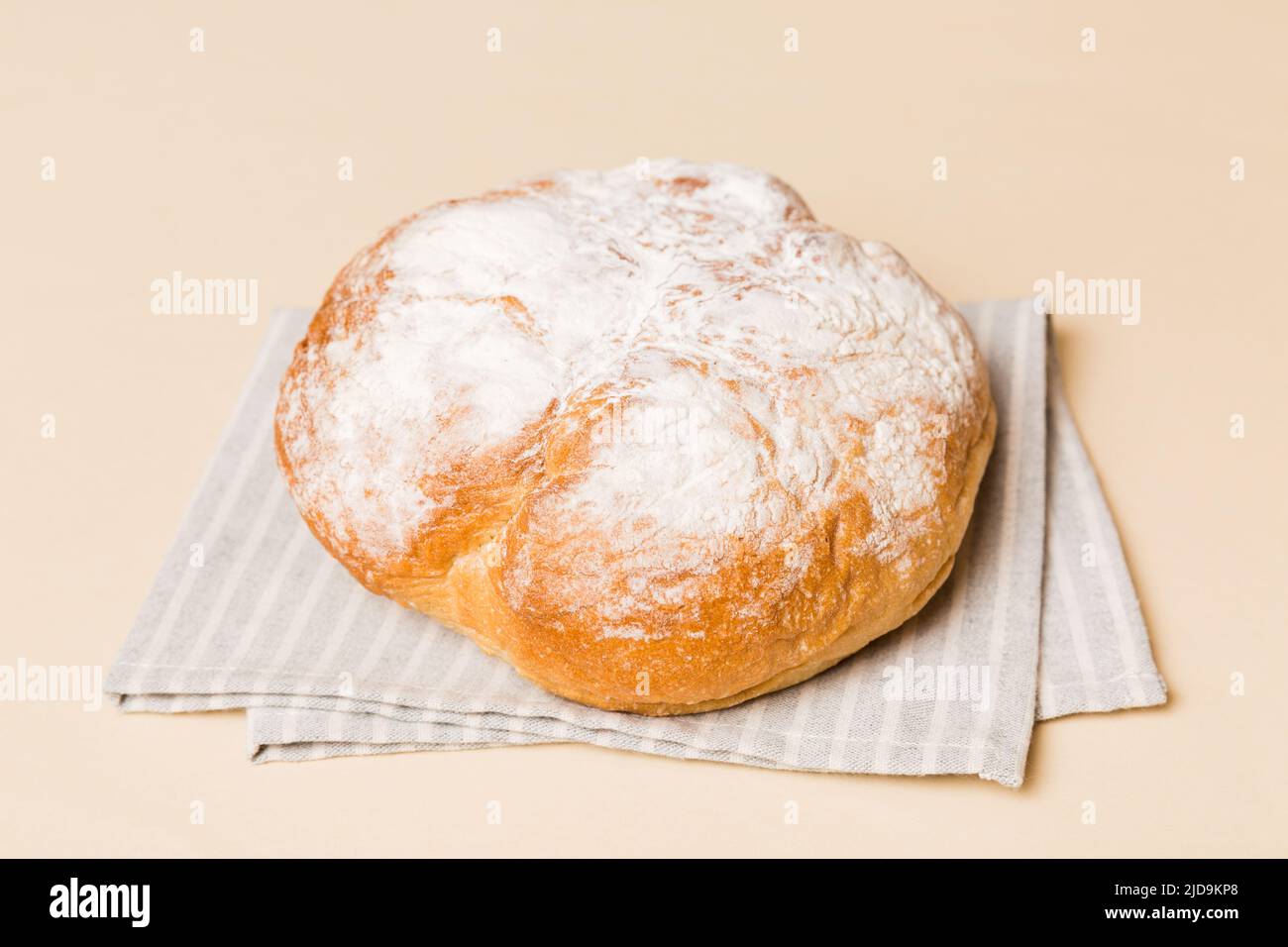 Assortment of freshly baked bread with napkin on rustic table top view