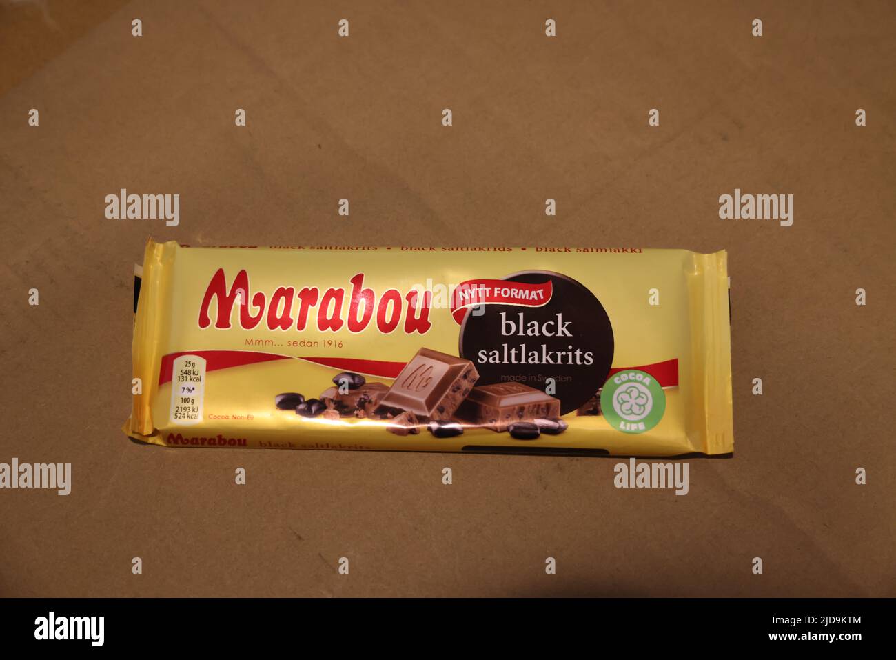 Marabou chocolate bar with salty licorice (black saltlakrits) from Sweden in typical yellow package (front side) Stock Photo