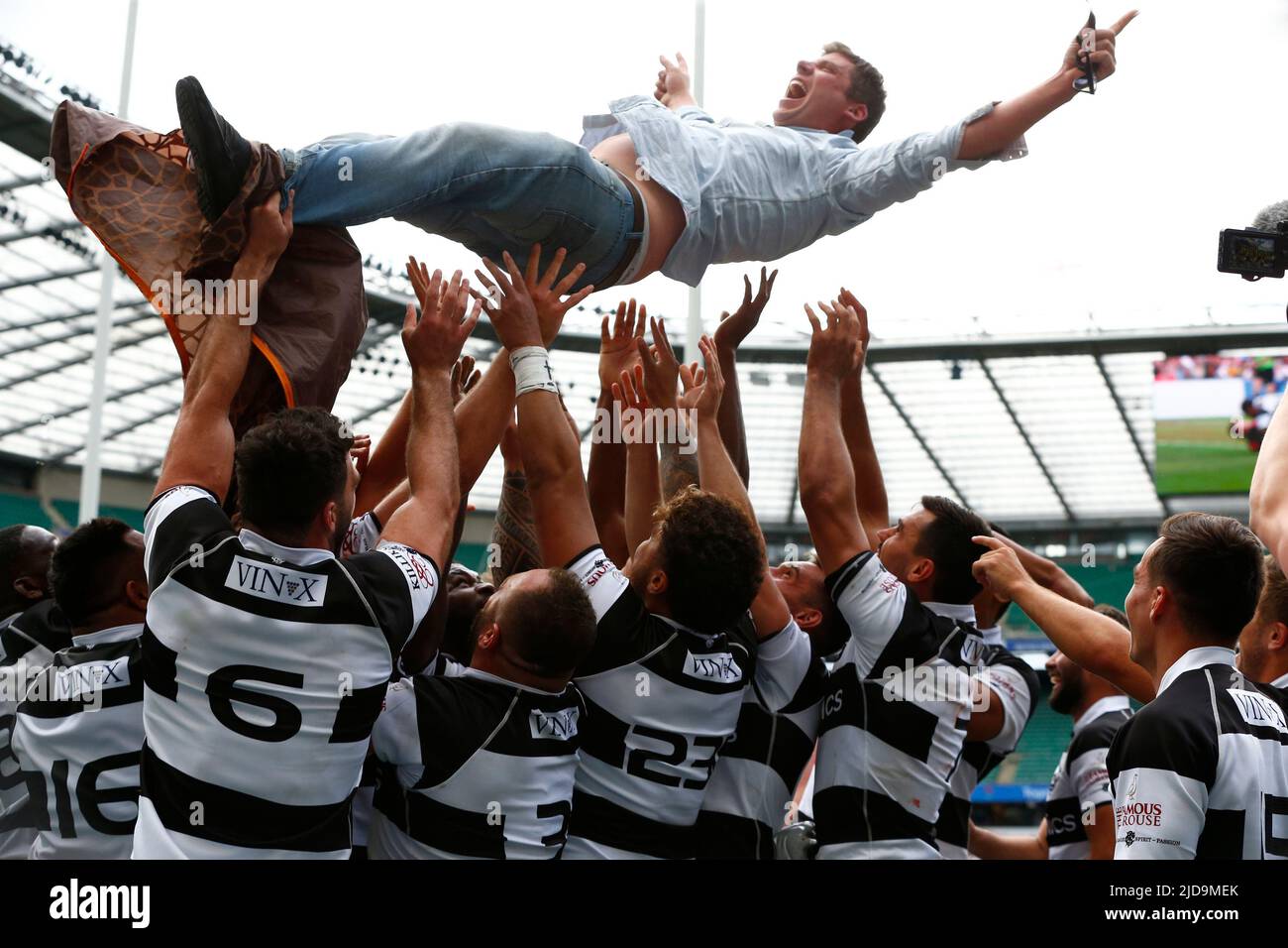 LONDON ENGLAND - JUNE 19 : Fan gets chunk up in the air by the Barbarians players after the game Killik Cup between England against Barbarians F.C at Twickenham stadium, London on 19th June, 2022 Credit: Action Foto Sport/Alamy Live News Stock Photo