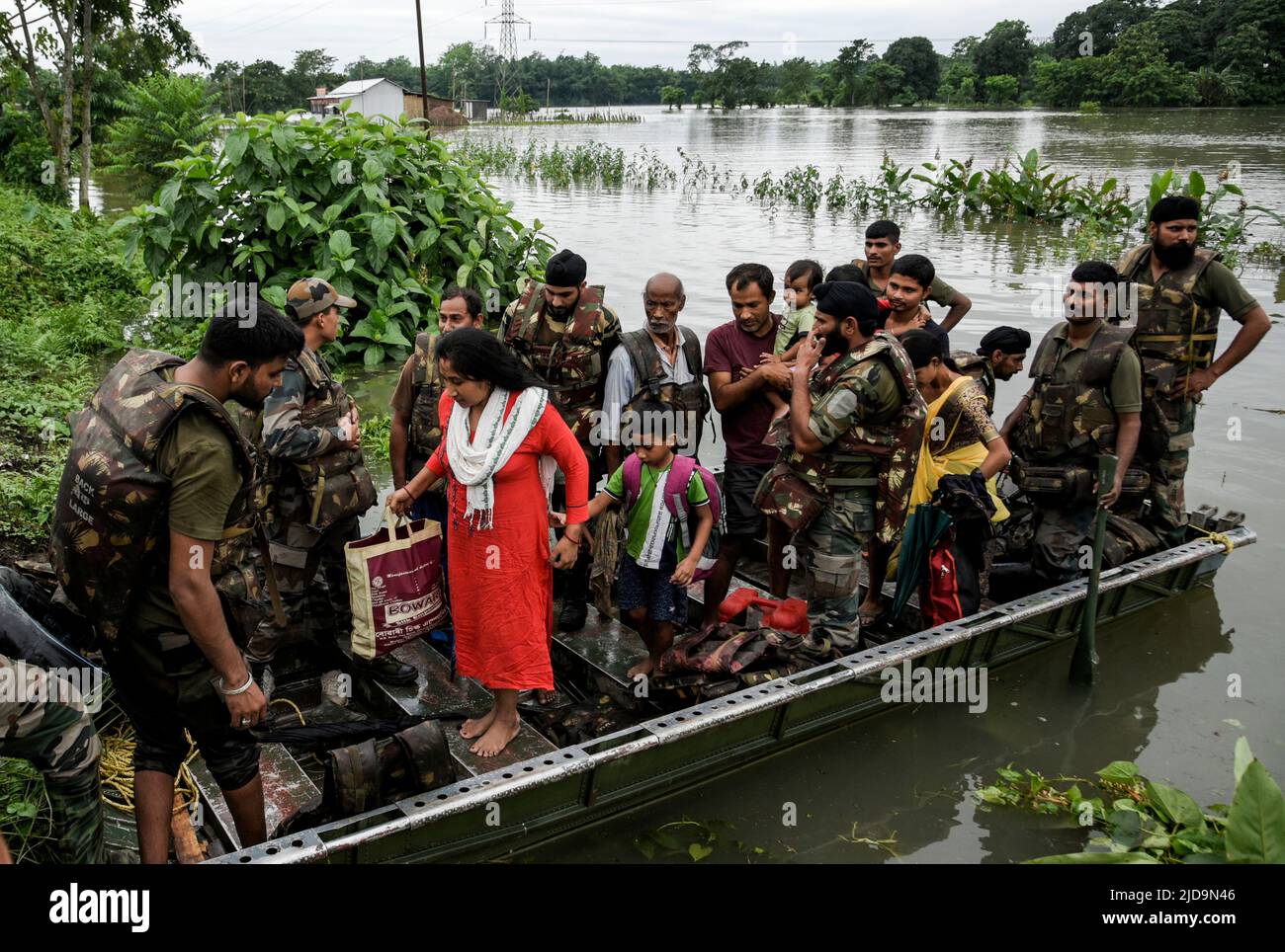 Punjab Regiment personnel rescue flood affected residents, at a village on June 17, 2022 in Barpeta, India. Assam flood situation deteriorates due to heavy rain, over a million people affected. Stock Photo