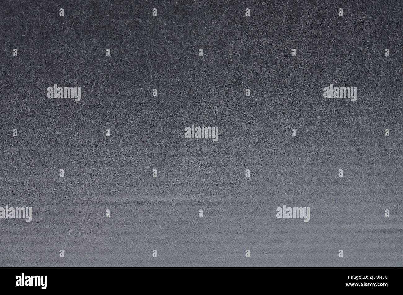 Smooth dark grey paper texture surface with lines close up view Stock
