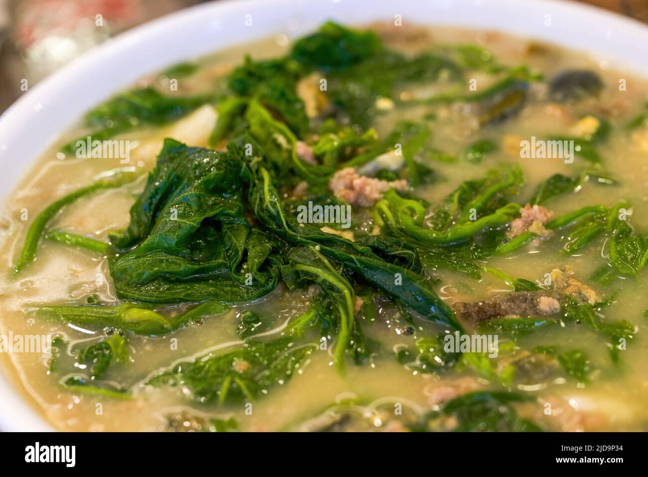 A delicious Chinese dish with wild vegetables in soup Stock Photo - Alamy
