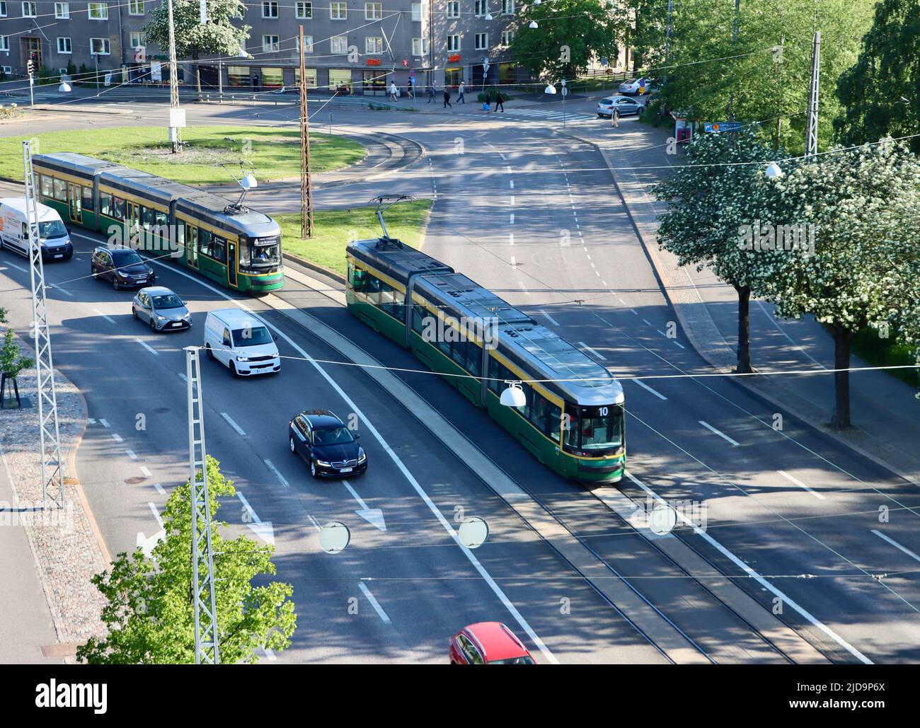 Yellow and green Helsinki trams, Finland June 2022 Stock Photo