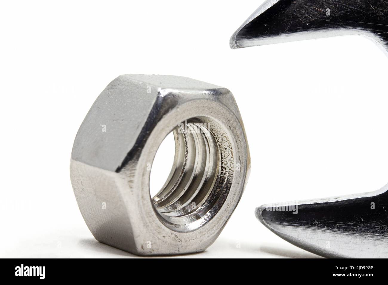bolt nut and wrench isolated on white background Stock Photo - Alamy