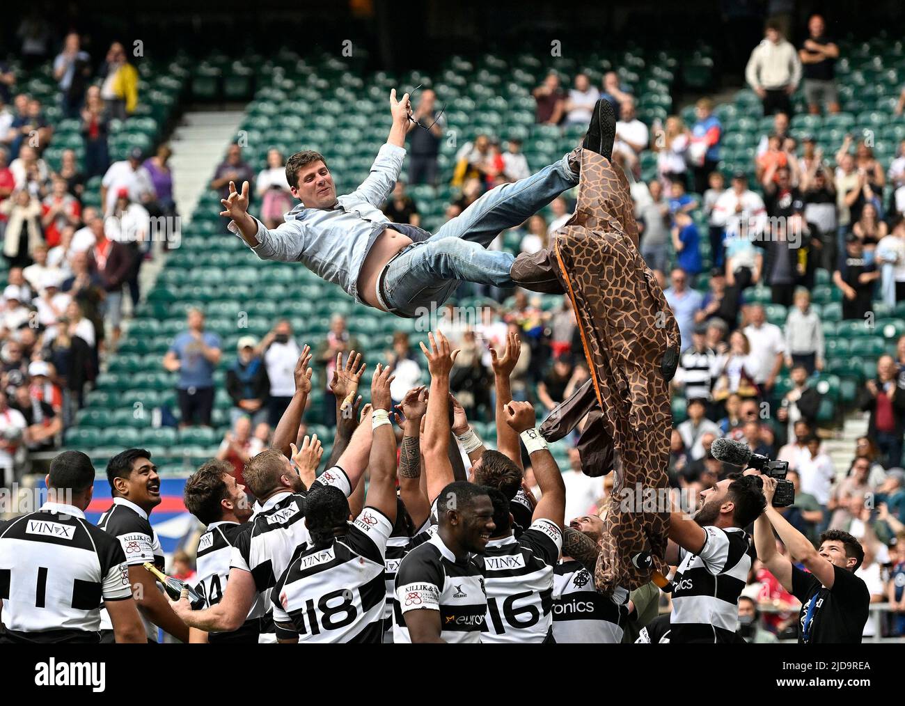 Twickenham, United Kingdom. 19th June, 2022. England V Barbarians. Twickenham Stadium. Twickenham. A pitch invader is thrown into the air by the Barbarians team at the end of the England V Barbarians rugby match. Credit: Sport In Pictures/Alamy Live News Stock Photo