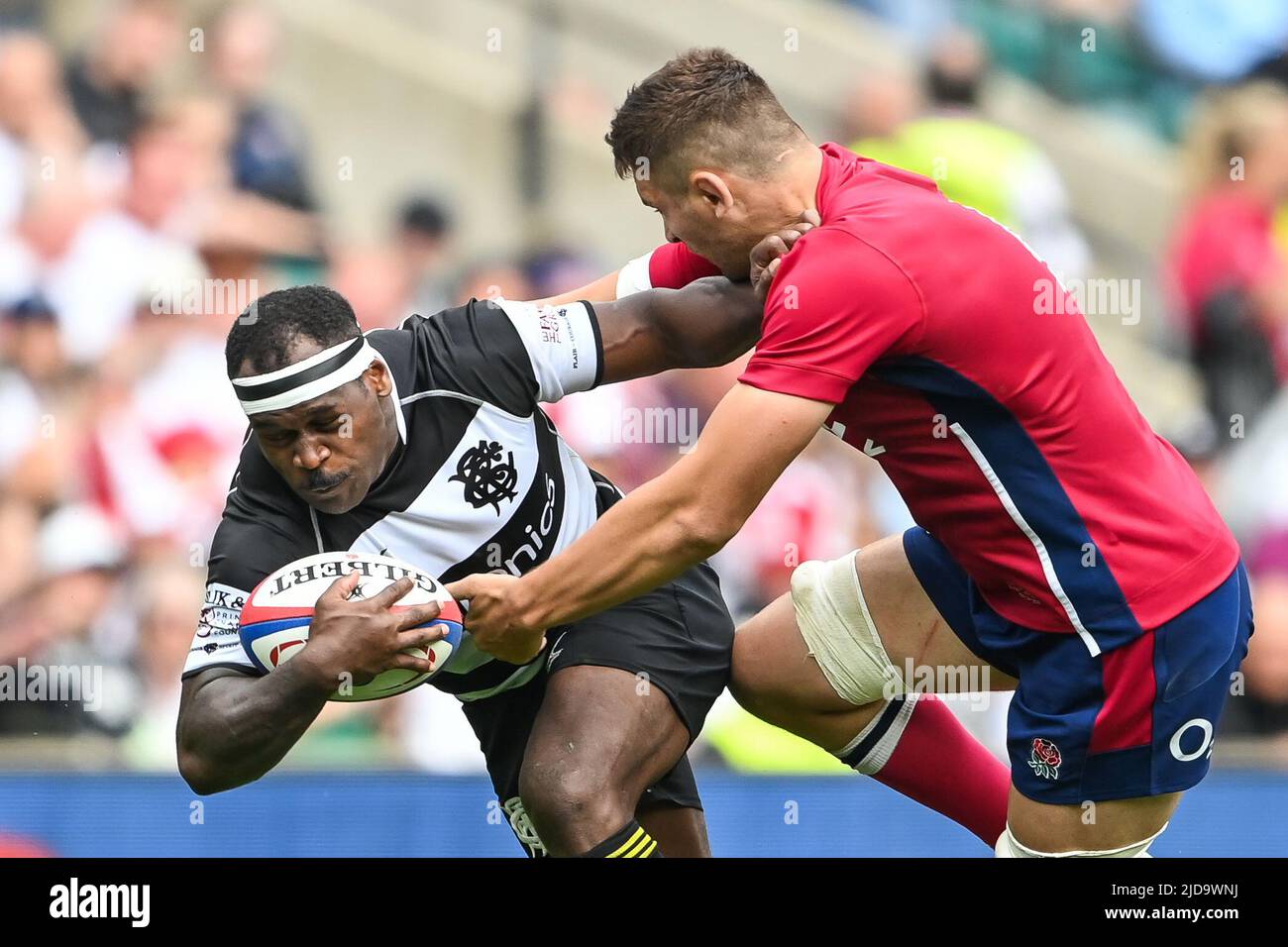 Levani Botia of Barbarians is tackled by Charlie Ewels of England Stock Photo
