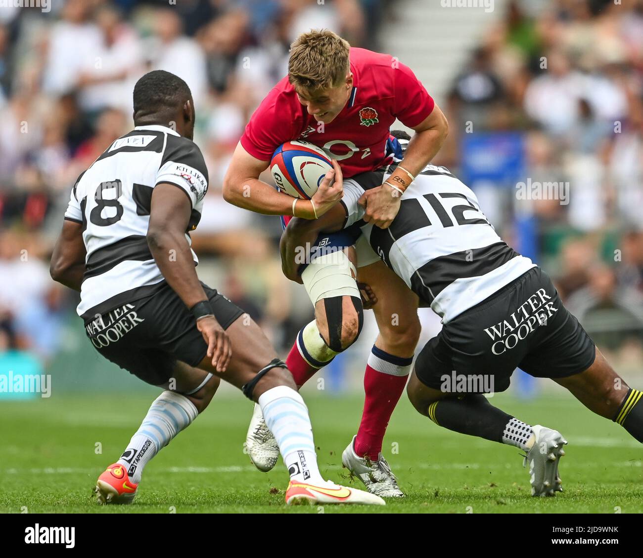 Tommy Freeman of England is tackled by Levani Botia of Barbarians Stock Photo