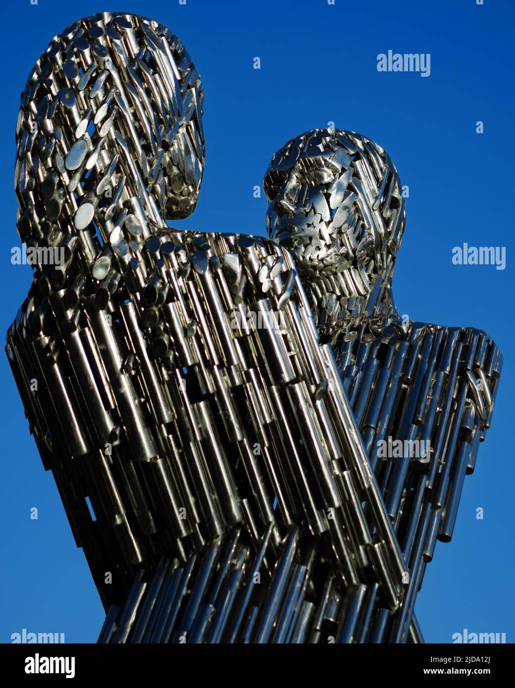 Kyiv, Ukraine - May 28, 2022: Sculpture of Unity on Dniprovska embankment. Two silhouettes, male and female, passing through each other. Man and woman Stock Photo
