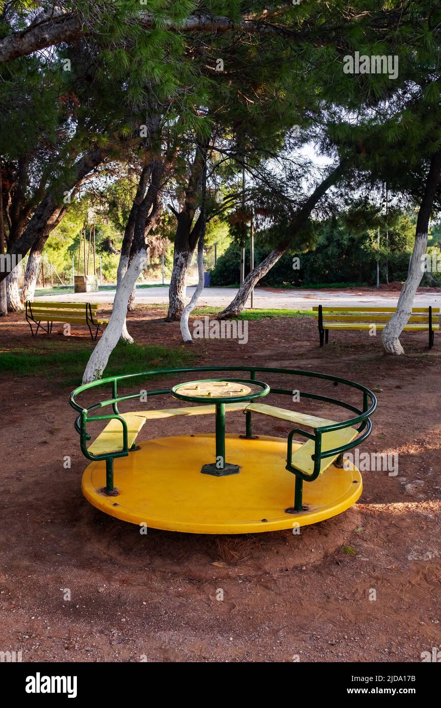 Merry-go-round in outdoor playground. Stock Photo