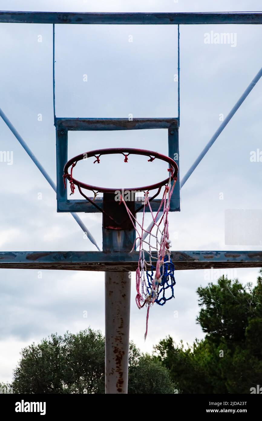 Torn basketball net in outdoor court Stock Photo - Alamy