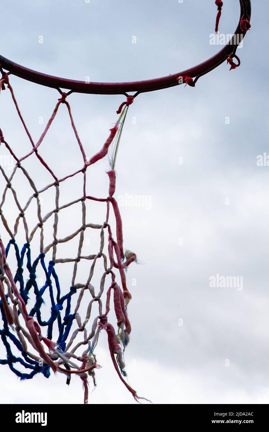 Torn basketball net in outdoor court Stock Photo Alamy
